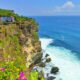 Uluwatu Temple is located on the edge of a cliff bordering the ocean.